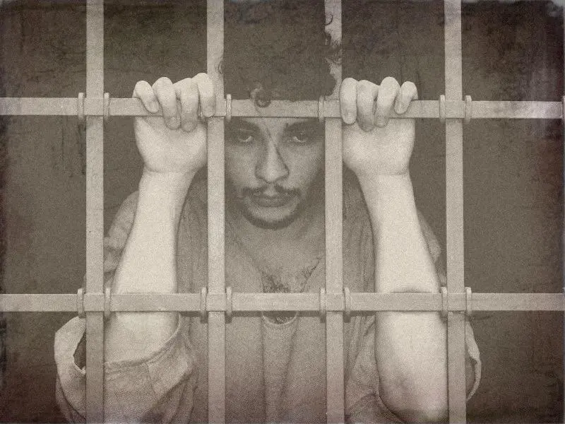 Locked away, awaiting judgment — historical reenactment